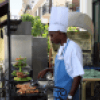 Cuban chef cooking outdoors